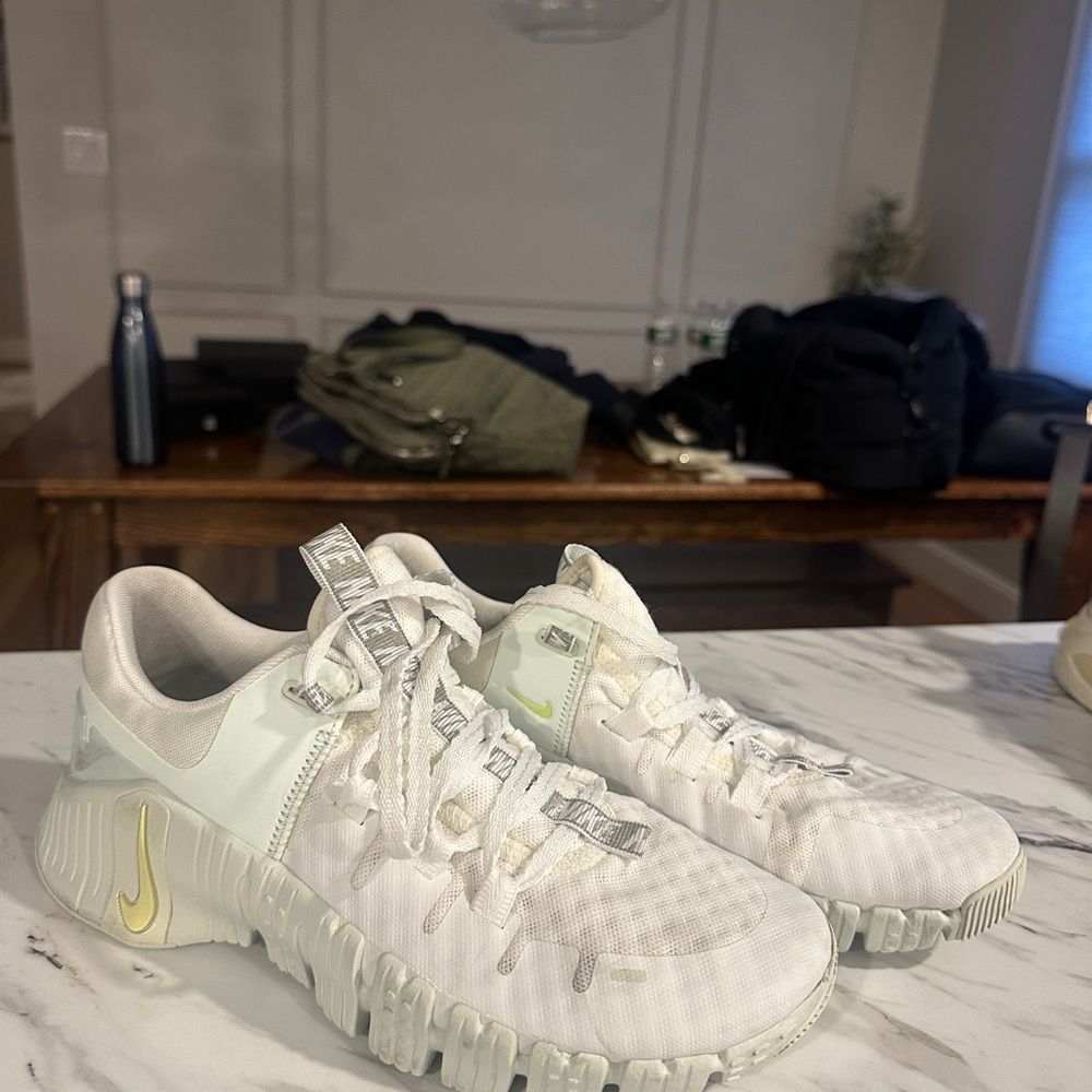 White and Yellow Athletic Shoes